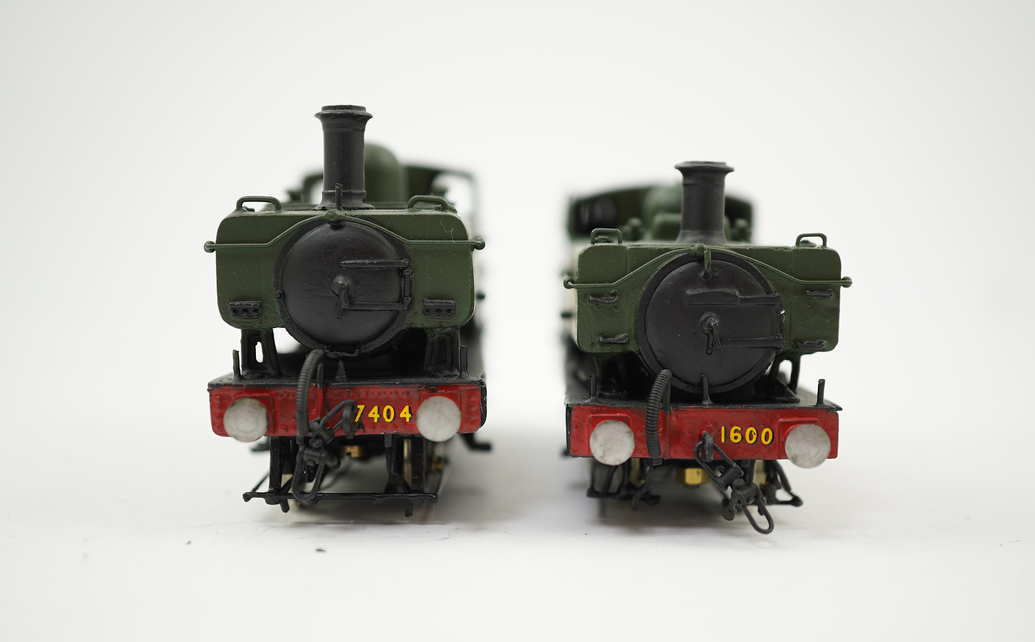 Two 00 gauge brass and white metal kit built GWR Pannier Tank locomotives; a 1600 class 0-6-0PT, 1600, together with an 7400 class 0-6-0PT, 7404, constructed, painted and lined to a high standard, both motored for two ra